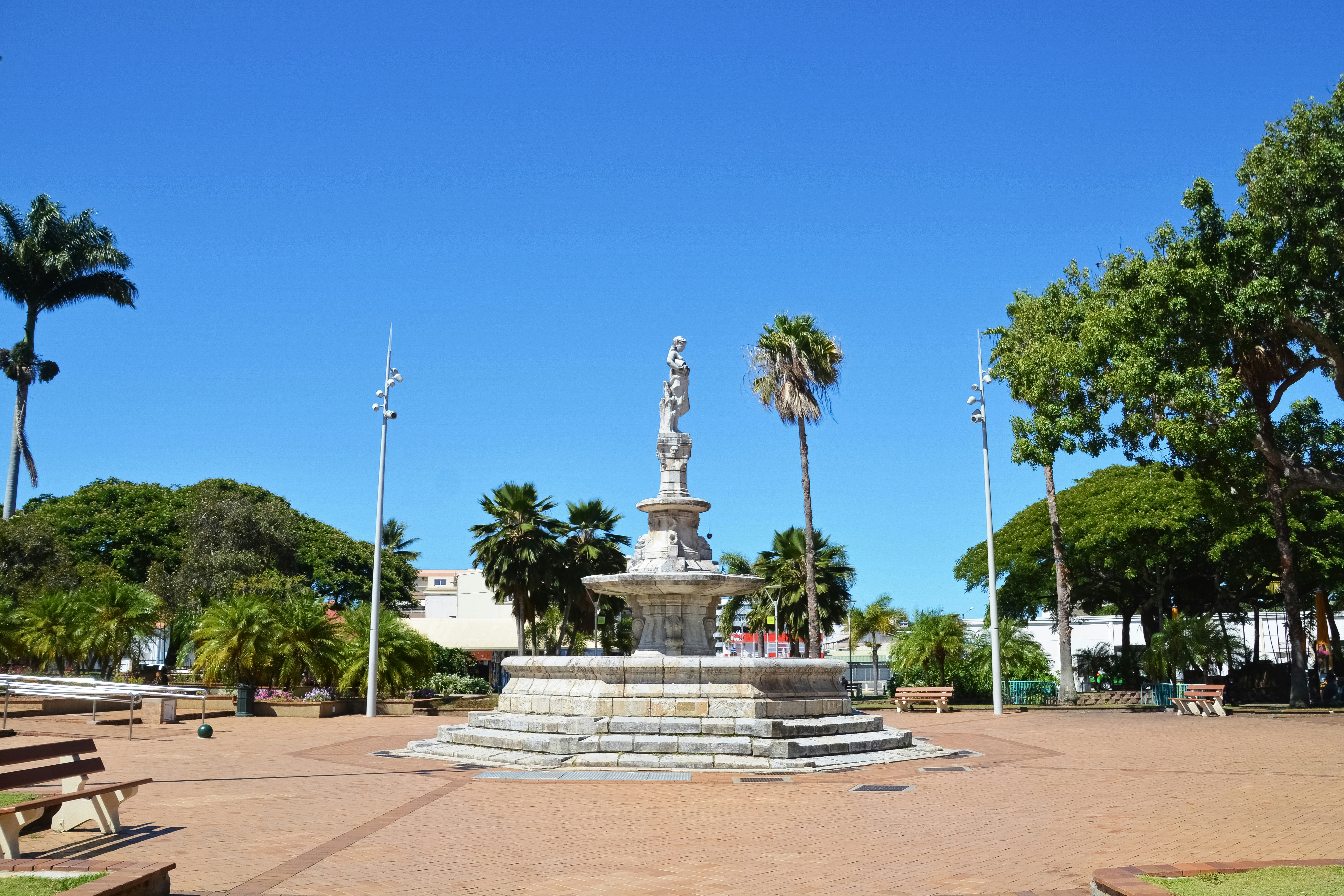 white concrete statue under blue sky during daytime